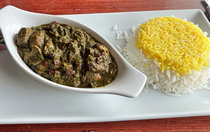 Ghormeh sabzi herb stew with saffron rice and pickles