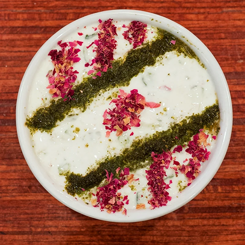 Maust khiar: yogurt with cucumber and herbs, topped with dried mint and rose petals